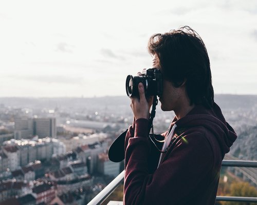 Person relaxing their eyes looking at the urban horizon
